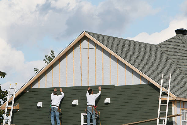 Professional Storm Damage Siding Repair technician working in Lynn, MA